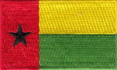 GUINEA-BISSAU TYGMÄRKE 65X38mm