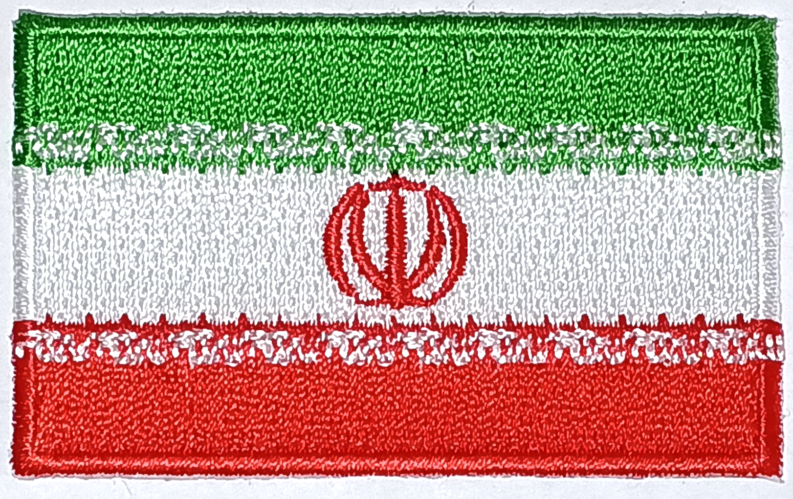 IRAN TYGMÄRKE 65x38mm
