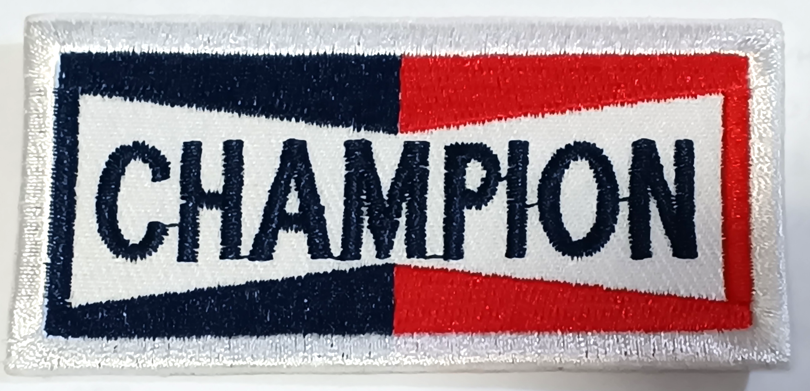 CHAMPION TYGMÄRKE 75X34mm