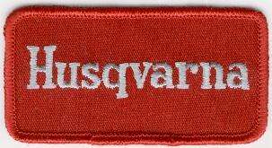 HUSQVARNA TYGMÄRKE 99x52mm
