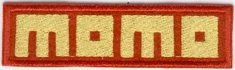 MOMO TYGMÄRKE 113x31mm