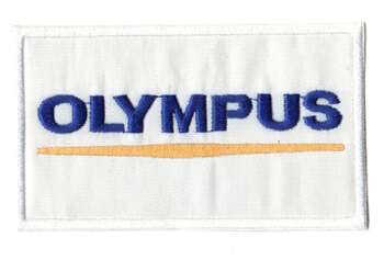 OLYMPUS TYGMÄRKE 102x60mm