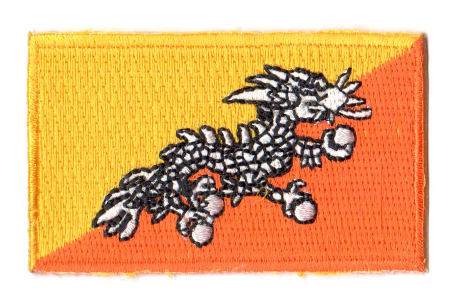 BHUTAN TYGMÄRKE 65x38mm