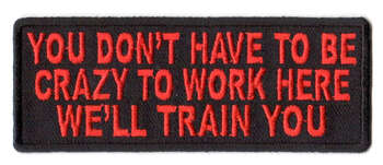 You Don't Have To Be Crazy To Work Here We'll Train You Tygmärke 101x38mm